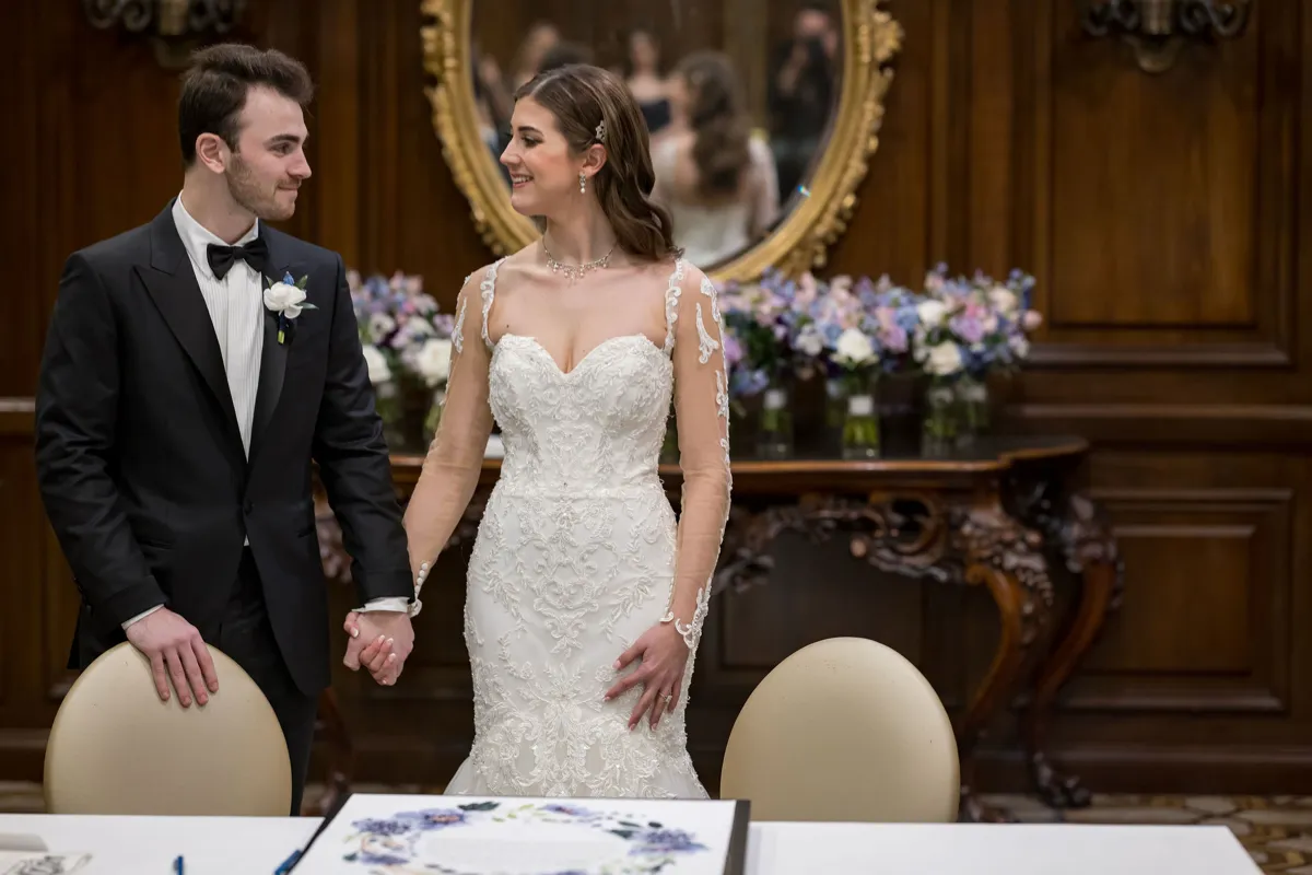 42 wedding couple signing ketubah